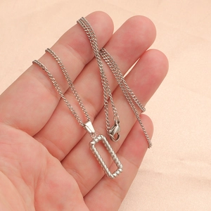 Detail of silver twisted rope rectangle pendant on a fine stainless steel chain