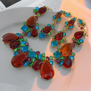 Vintage waterdrop crystal necklace set with multi-colored gemstones in golden finish