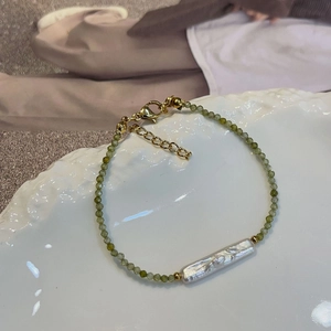 Olive green faceted zircon and baroque freshwater pearl necklace with gold clasp