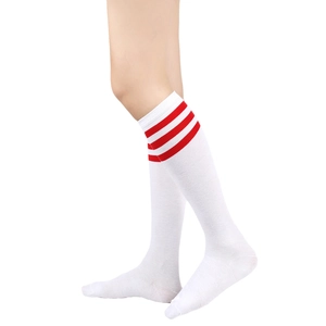 Close-up of white knee-high socks with red triple stripes in elastic knit fabric