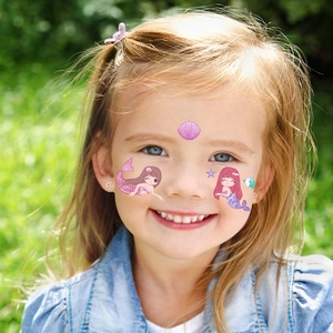 Waterproof glitter mermaid face tattoo stickers for kids with colorful ocean themed patterns