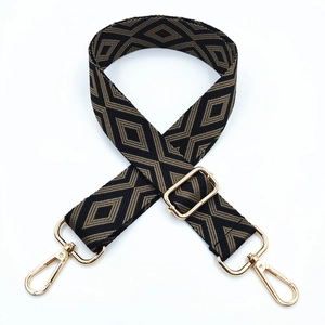 Close-up of diamond pattern woven shoulder strap with adjustable golden metal buckle