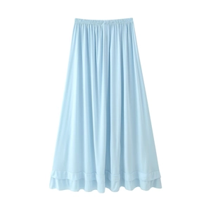 Detail of light blue maxi skirt featuring an elastic waistband and double-layered ruffles