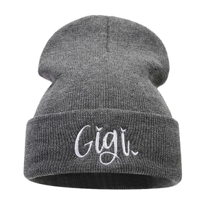 Gray knitted beanie hat featuring white Gigi letter embroidery on a white background