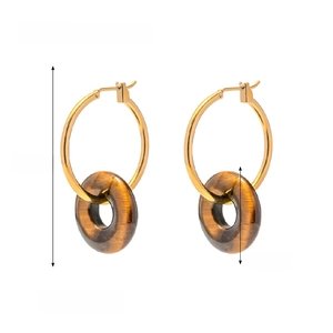 Detailed view of gold plated hoop earrings with brown tiger eye stone donut pendants