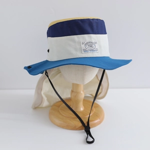 Detail of multi-color sun hat featuring breathable mesh panels and neck protection flap