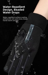 Close-up of waterproof winter gloves with water droplets and touch screen fingertips