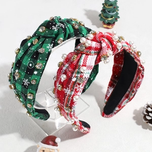 Christmas knotted headbands with rhinestones and pearls on a festive plaid pattern