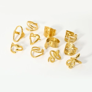 Detailed top view of ten assorted 18K gold plated adjustable stainless steel rings