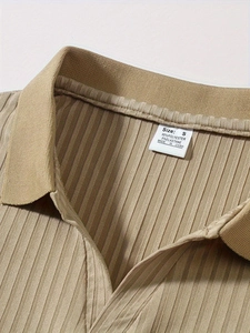 Detail of the khaki polo collar showing ribbed texture and internal size label