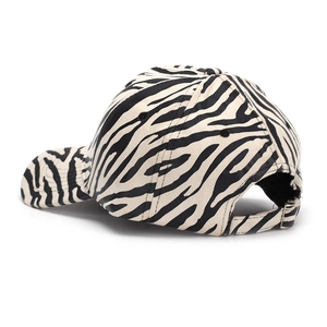 Zebra print baseball cap detail showing the metal buckle and six-panel stitch construction