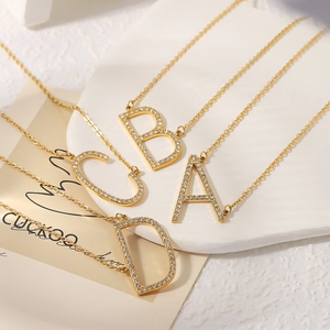18k gold plated stainless steel letter pendants with sparkling crystals on thin chains