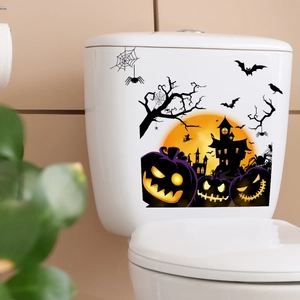 Halloween toilet sticker showing glowing pumpkins and haunted house under orange moon