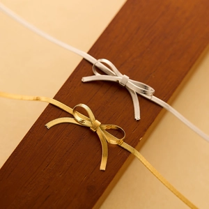 Elegant bow-shaped titanium steel choker necklace in gold and silver metallic mesh finish