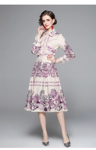 Detail of floral printed midi dress with long sleeves and elegant button-down collar