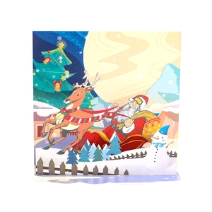 3D pop-up Christmas card featuring Santa Claus, reindeer, and snowman in snowy village scene