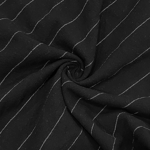Close-up of black breathable linen blend fabric with white pinstripe texture