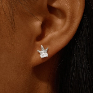 Close-up of s925 silver cartilage stud with heart geometric pendant and white zircon inlay