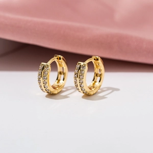 Detailed macro view of 18K gold plated double row zircon small hoop earrings set