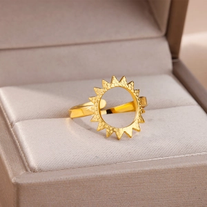 Detailed view of 18k gold plated sunburst hollow ring with textured dot details