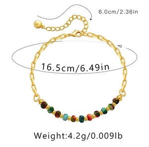 Detail of 18K gold-plated chain bracelet with colorful beads and adjustable extension