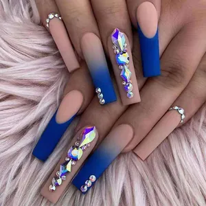 Detail of extra long square press-on nails with deep blue matte and gradient rhinestone deco