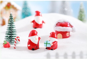 Miniature resin Christmas figurine set with Santa and tree on a snowy landscape detail