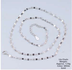 Detail of a thin S925 sterling silver lip chain necklace with adjustable pear-shaped tag