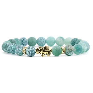 Green weathered agate bead bracelet featuring a golden elephant charm and rhinestone spacers