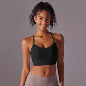 Close-up of black racerback sports bra with thin straps and smooth brushed fabric