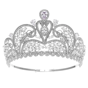 Elegant silver bridal crown with shimmering white crystals and rhinestones on white background