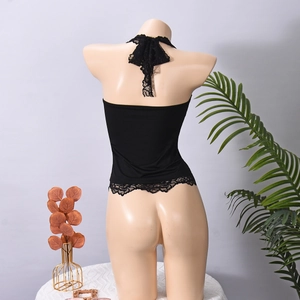Detailed back view of black halter top featuring delicate lace trim and open back design