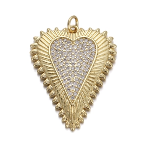 Detailed view of a gold heart charm with shimmering crystals and sunburst edge design
