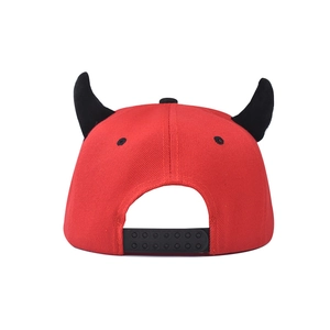 Detail of red hip-hop cap featuring black 3D devil horns and adjustable back strap