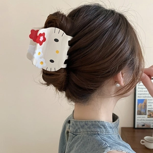 Detailed back view of a cute cartoon cat hair claw clip with colorful resin flowers