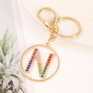 Detail of gold letter N keychain featuring vibrant multi-colored rhinestones and lobster clasp