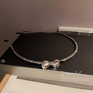 Elegant silver hairband with rhinestone bow and sparkling pear-shaped crystals