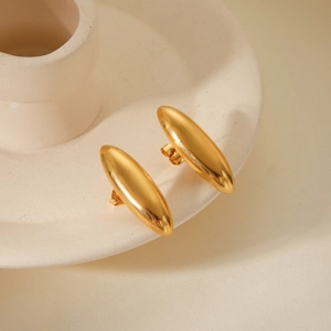 Minimalist gold oval mirror-finish stainless steel stud earrings on ceramic