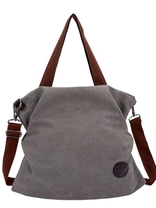 Sac fourre-tout gris en toile avec anses brunes et bandoulière réglable