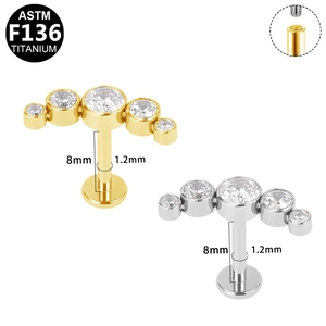 Macro detail of G23 titanium labret studs with cubic zirconia and internal threading