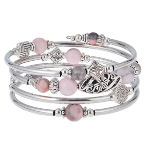 Detailed close-up of Bohemian multi-layer bracelet with natural stone beads and charms