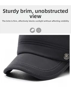 Detail of grey winter hat showing the durable textured fabric and silver R-Sport metal badge