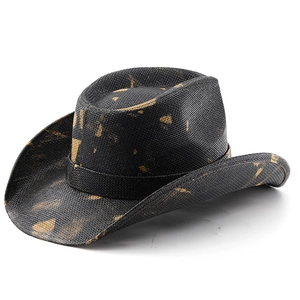 Detail shot of vintage camouflage cowboy hat with distressed gold texture and woven straw