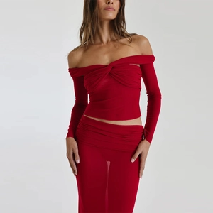 Detail of red off-shoulder long sleeve top with mesh ruched maxi skirt set