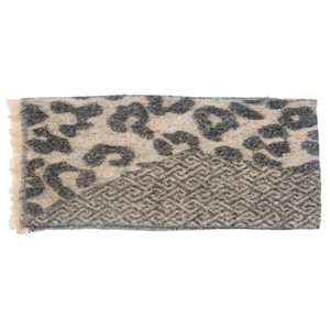 Detailed view of grey leopard print scarf with geometric patterns and fringe edges