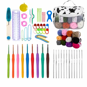 Detail of crochet kit with colorful ergonomic hooks, yarn rolls, and a cow print bag