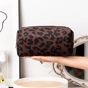Handheld leopard print makeup bag with large capacity and durable zipper closure