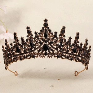 Close-up of gothic bridal crown featuring black rhinestones on a vintage metal frame
