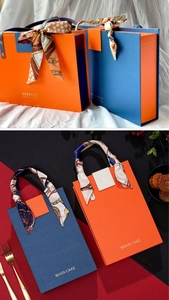 Close-up of premium moon cake gift box with elegant silk ribbon handles and texture