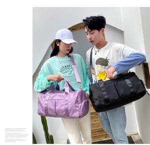 Fashionable travel bag in purple and black shown with models in an outdoor setting